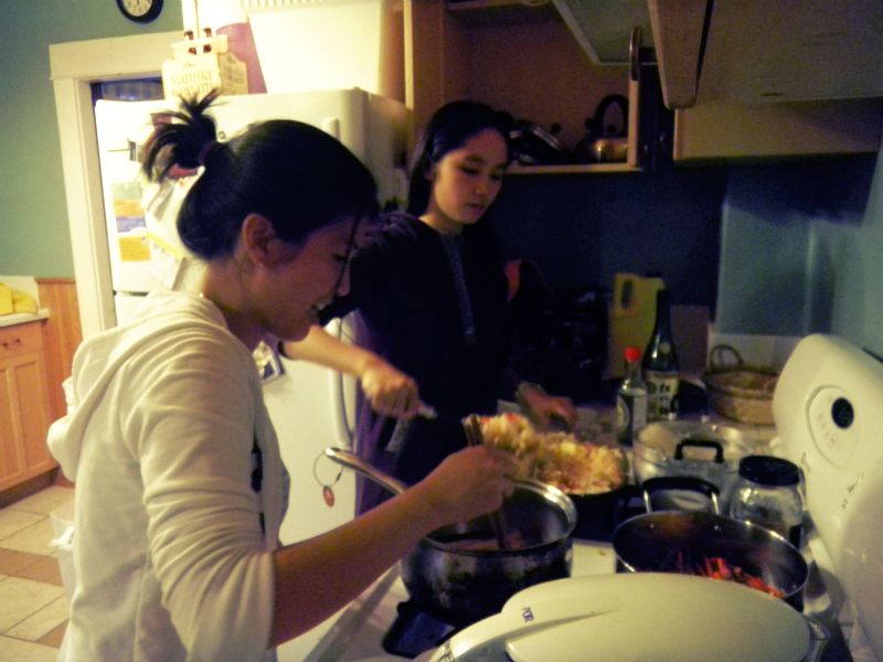 Dongni is making Chinese fried rice, and Uyen is preparing for Vietnamese spring rolls.