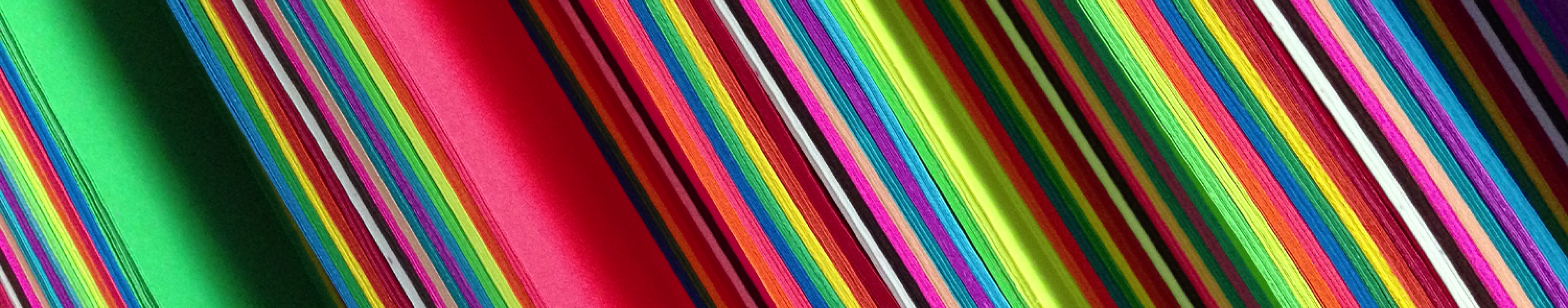 a close up photo of brightly colored paper