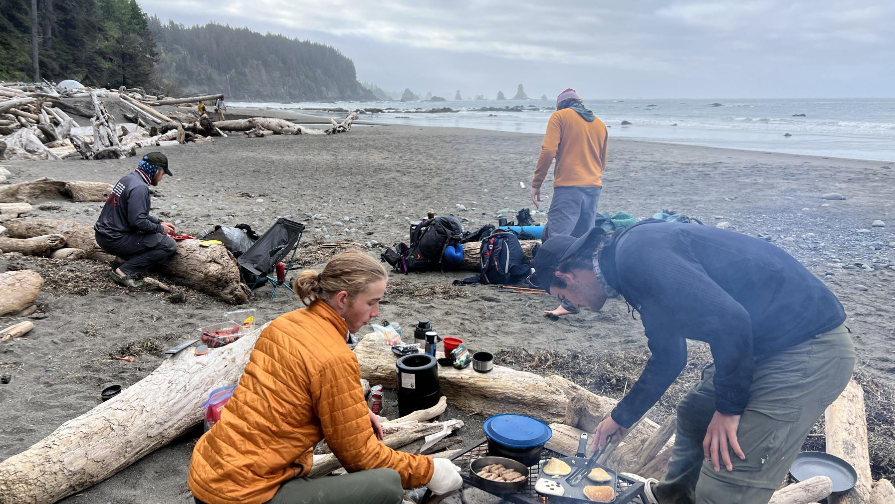 PacTrail students cook over a driftwood fire on the Washington coast.