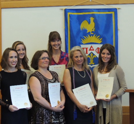 Students being initiated to Pi Delta Phi. Students being initiated to Pi Delta Phi.
