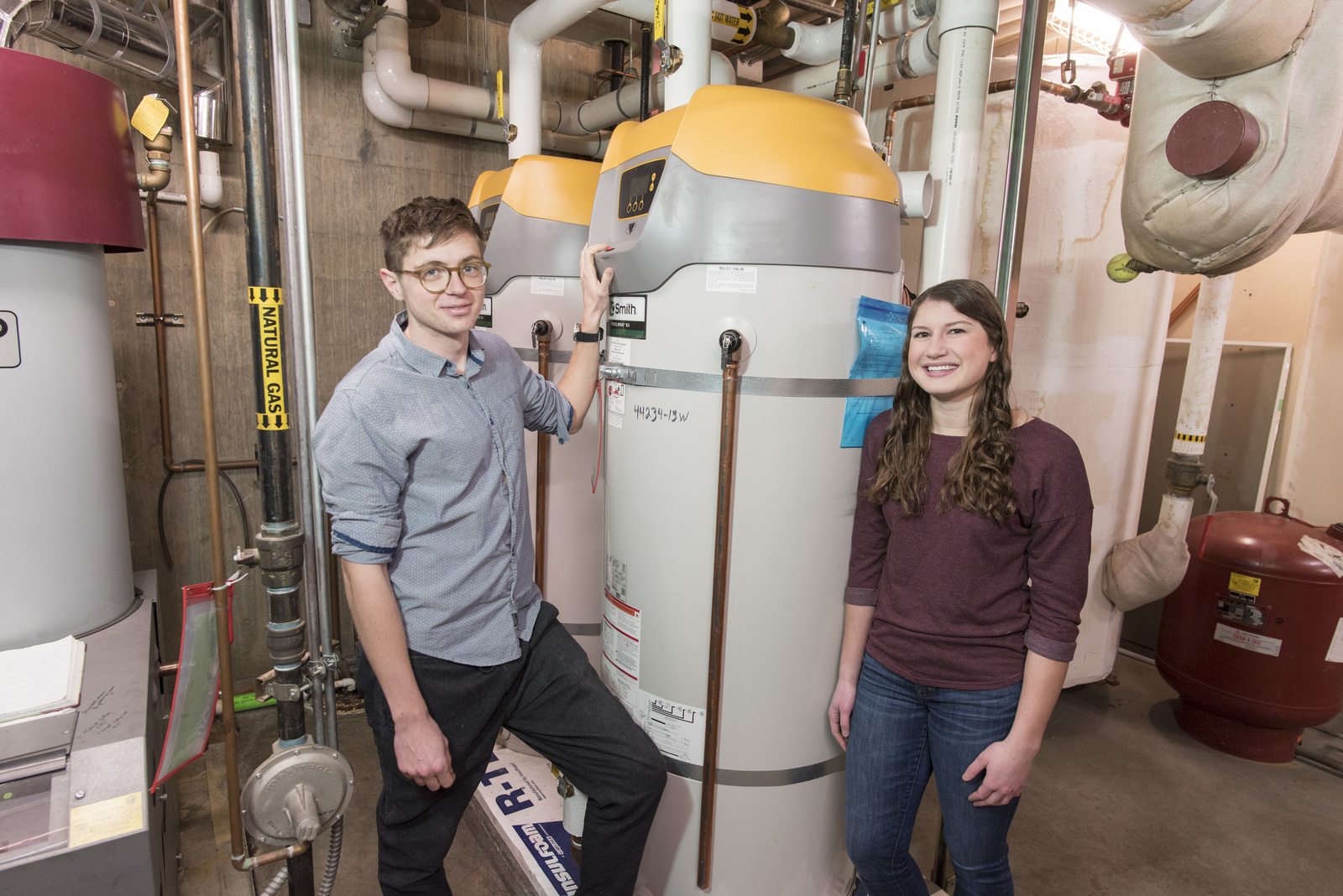 Matthew Gulick ’18 and Shelby Kantner ’18, next to residence hall water heaters.