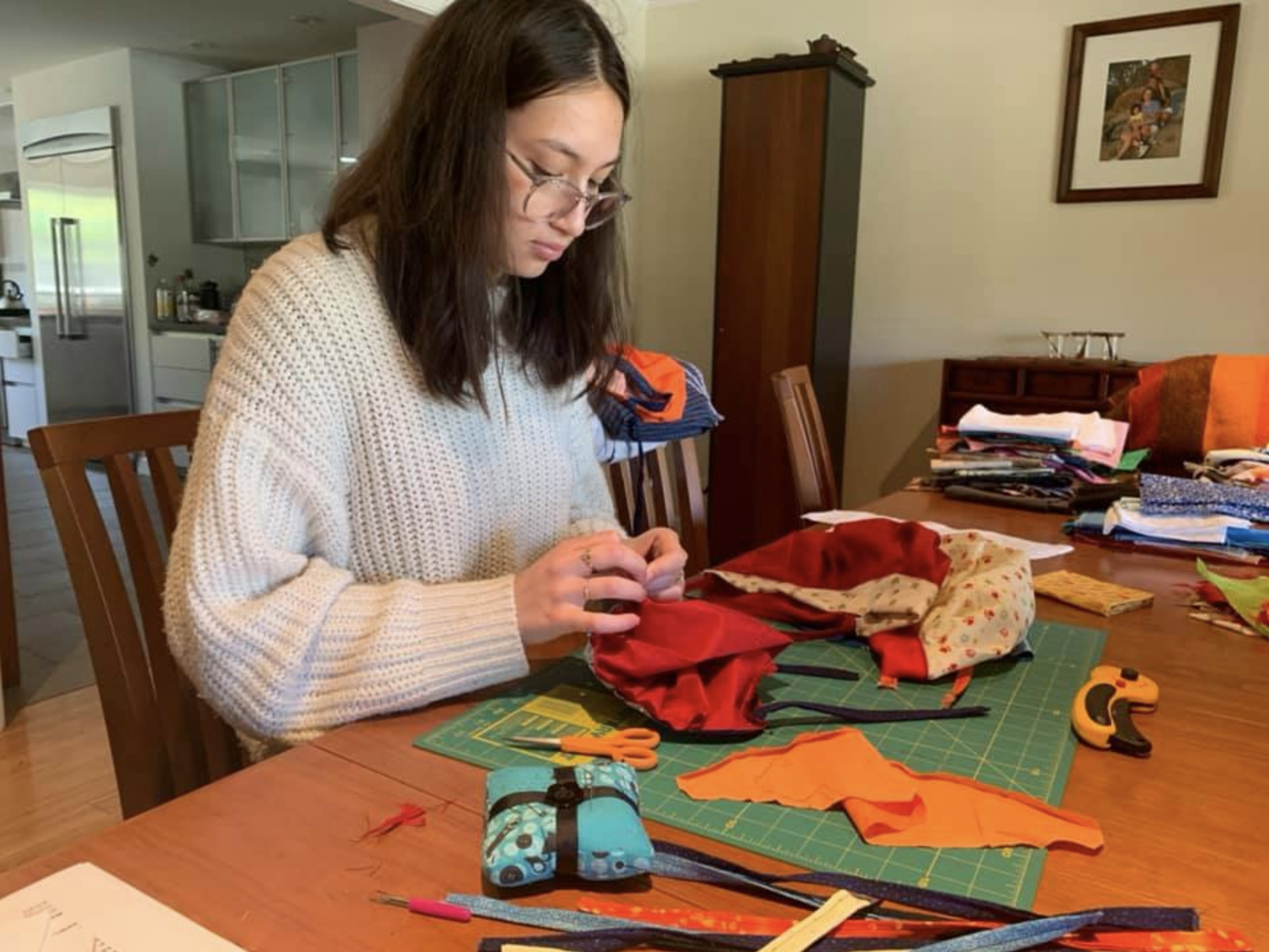 A woman working with sewing materials