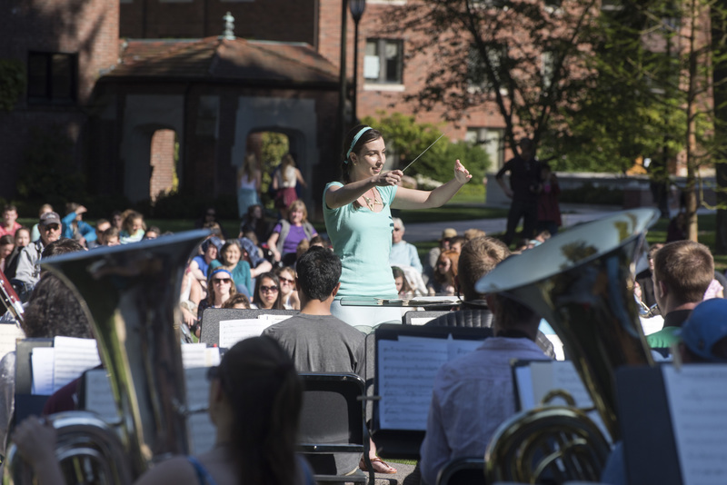 Student conducting during Pops on the Lawn