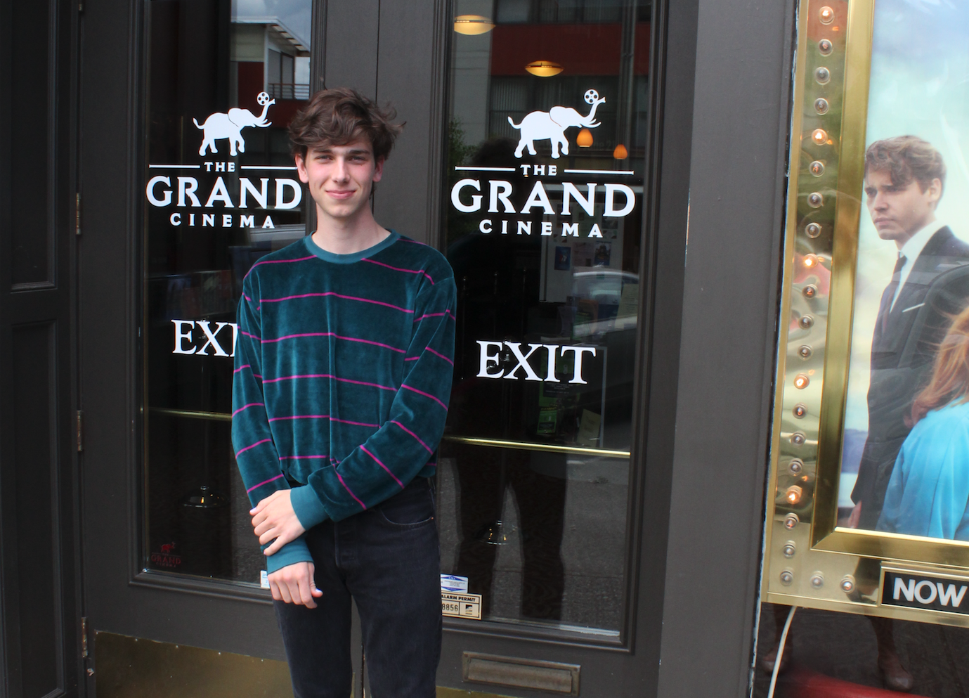 Student standing in front of a building