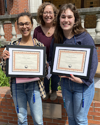 Sabine Angier and Clarissa Troutman receiving award from Stacey Weiss