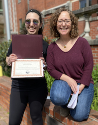 Shani Zelenko receiving award from Stacey Weiss