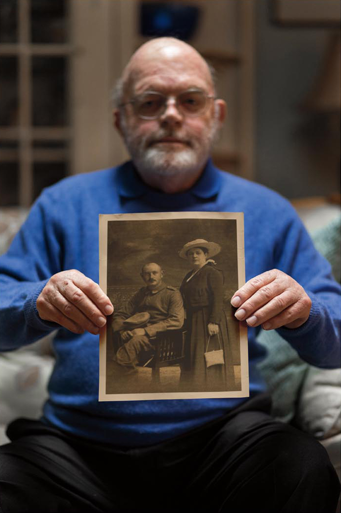 Henry Haas ’60 holding an image of his grandparents