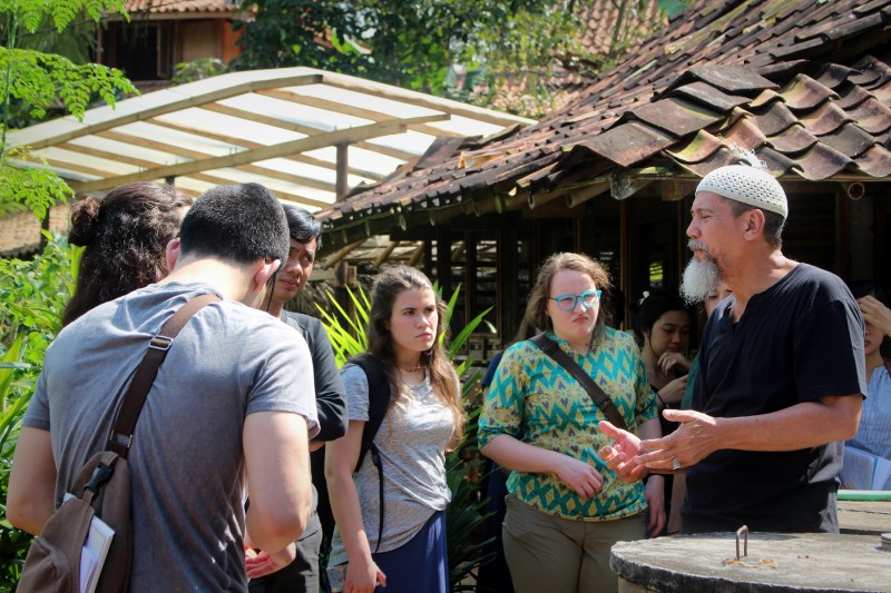 A group of students listening to a speaker