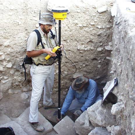 People using archaeological equipment on site