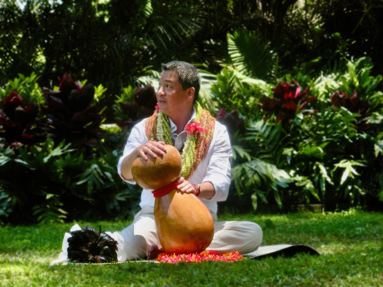 Michael Pili Pang ’84 performing hula outdoors.