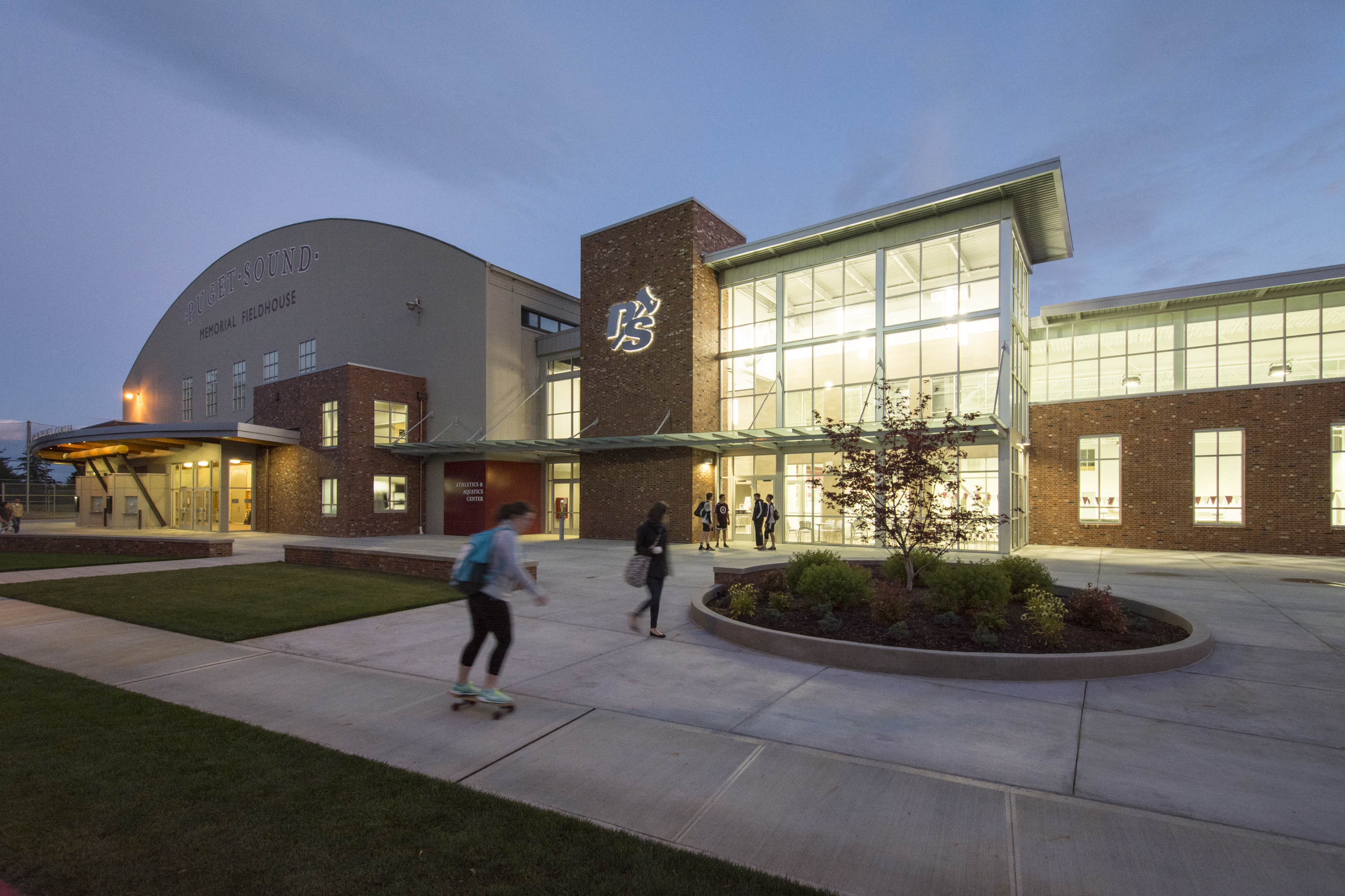 Athletics and Aquatics Center at night.