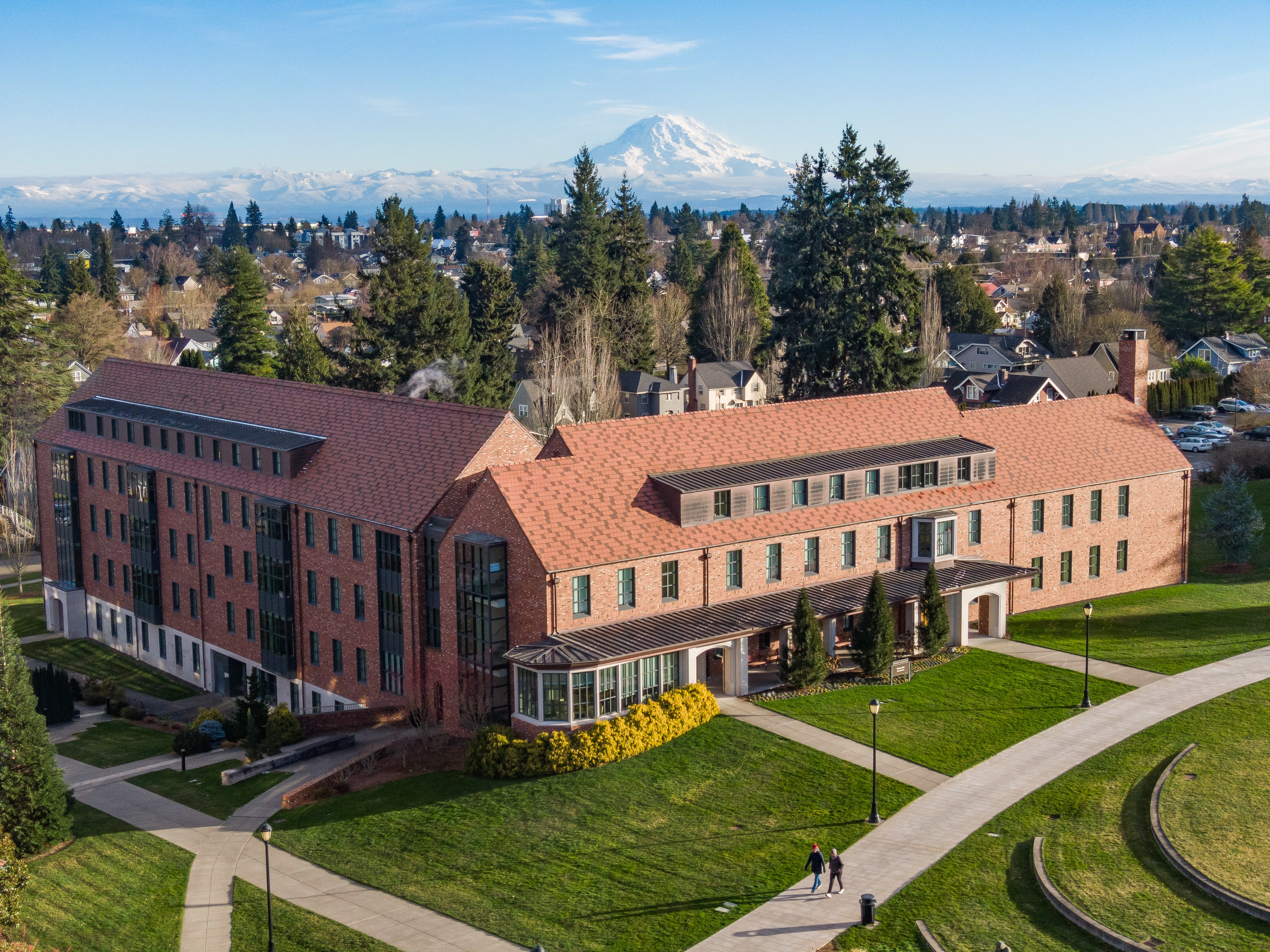 University campus is seen from above with Mount Rainier behind it. 