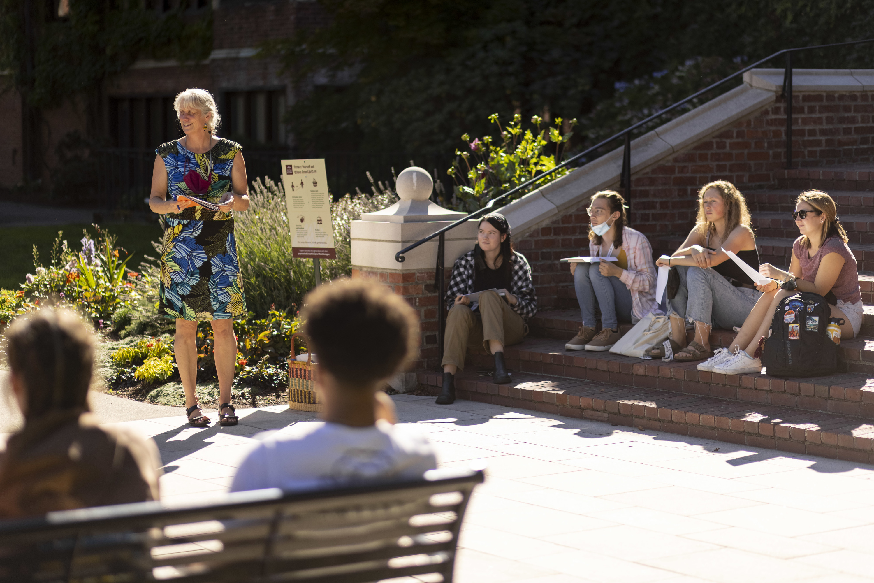 Professor Lynnette Claire teaches her business class on the steps of Jones Hall.