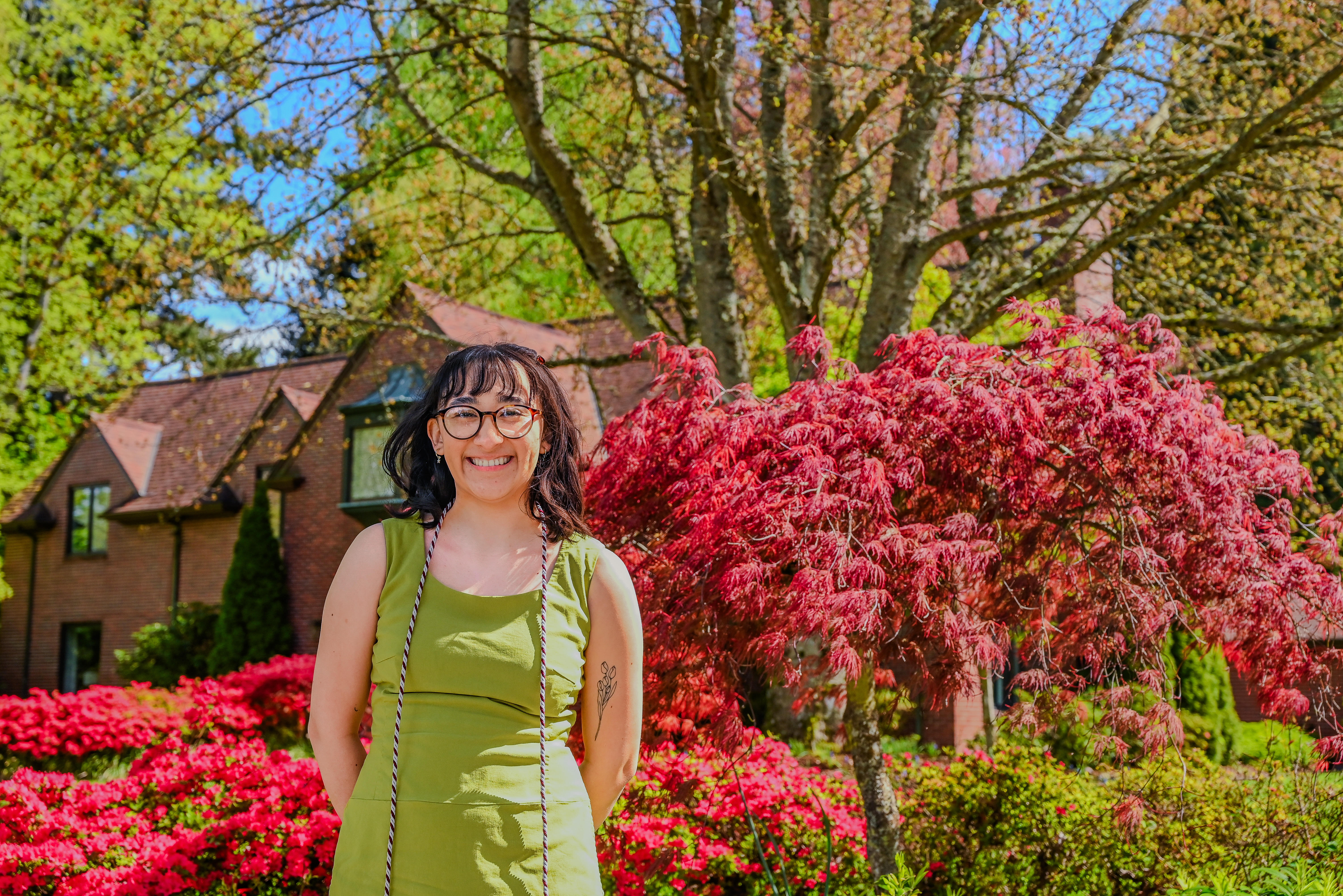 Angela Ronces-Cortes ’24 in front of the President's Residence during Commencement Weekend.