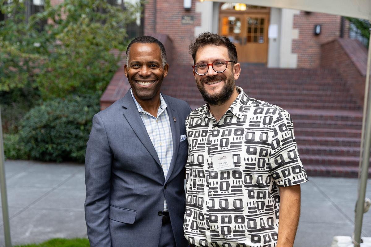 Sam Kigar, Associate Professor of Religion Spirituality, & Society, accepts the President's Excellence in Teaching Award. 