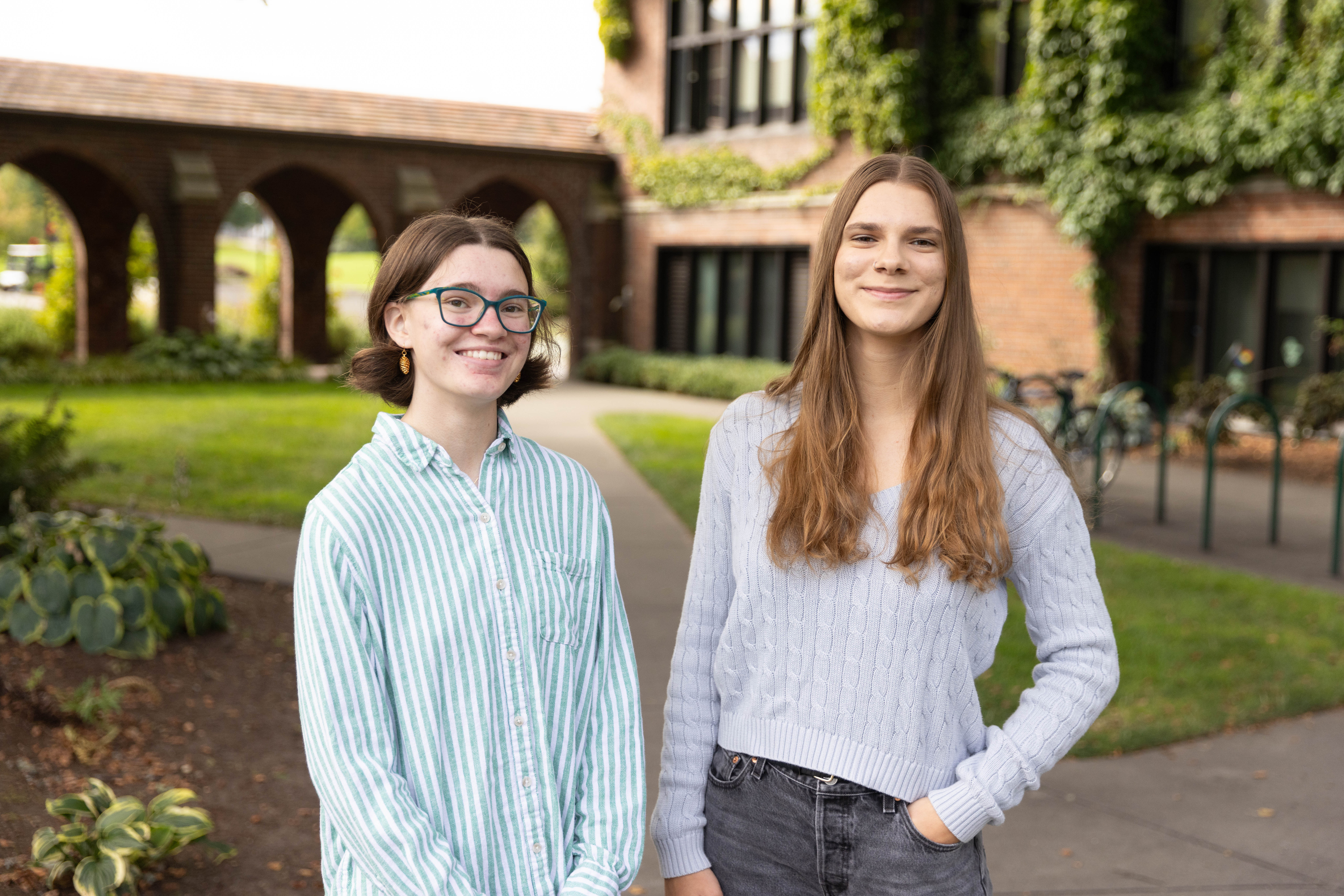 Grace Shirley stands next to Lin McDonald on the university campus. 