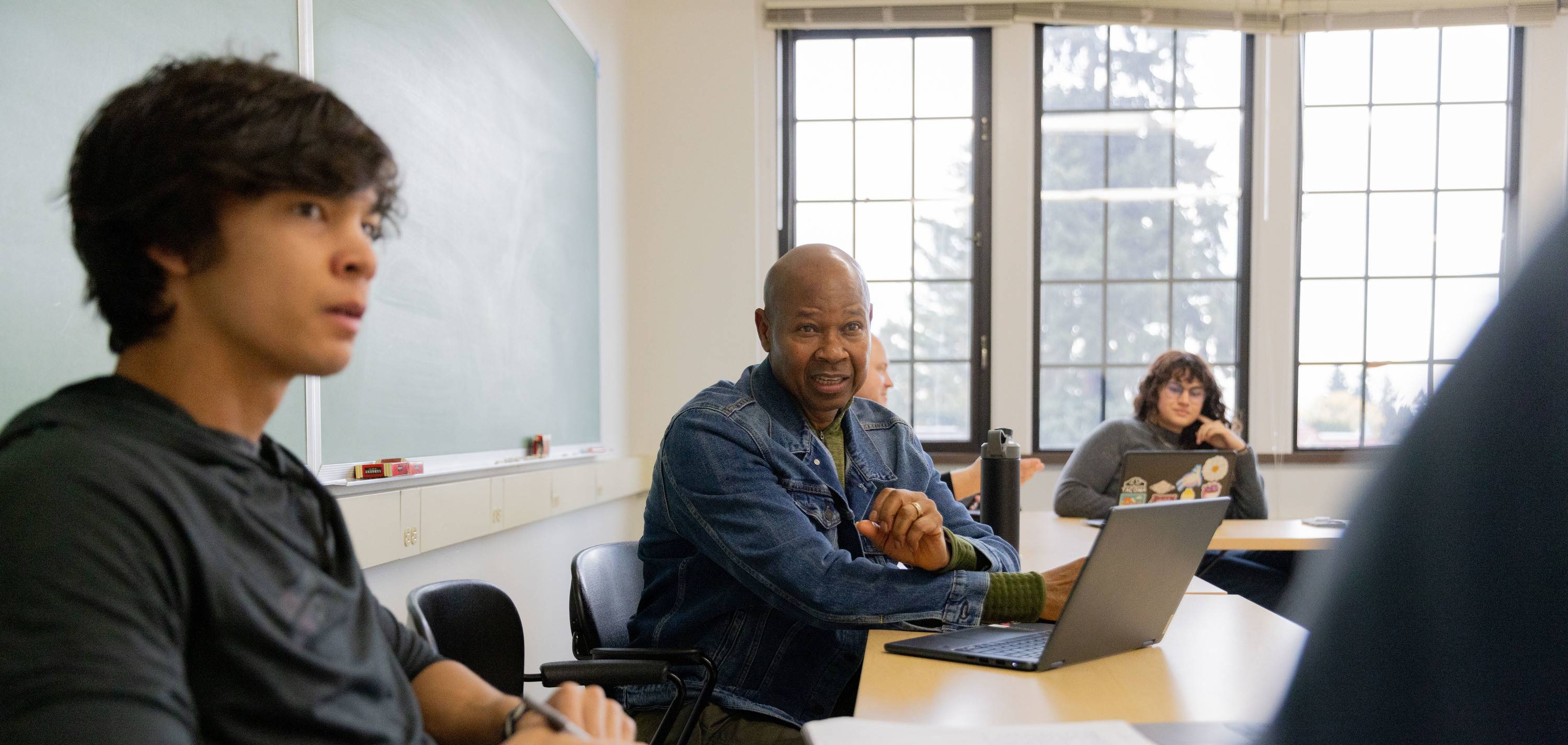 MPH students engage in classroom discussion.