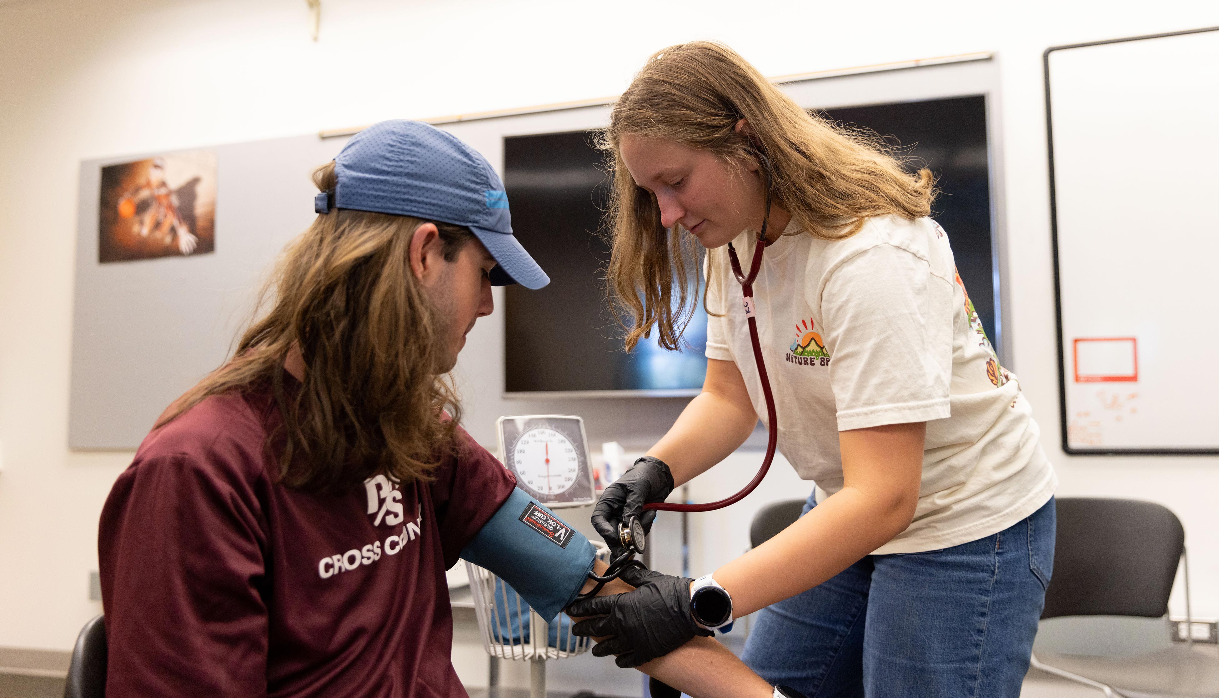 Exercise science student performing tests