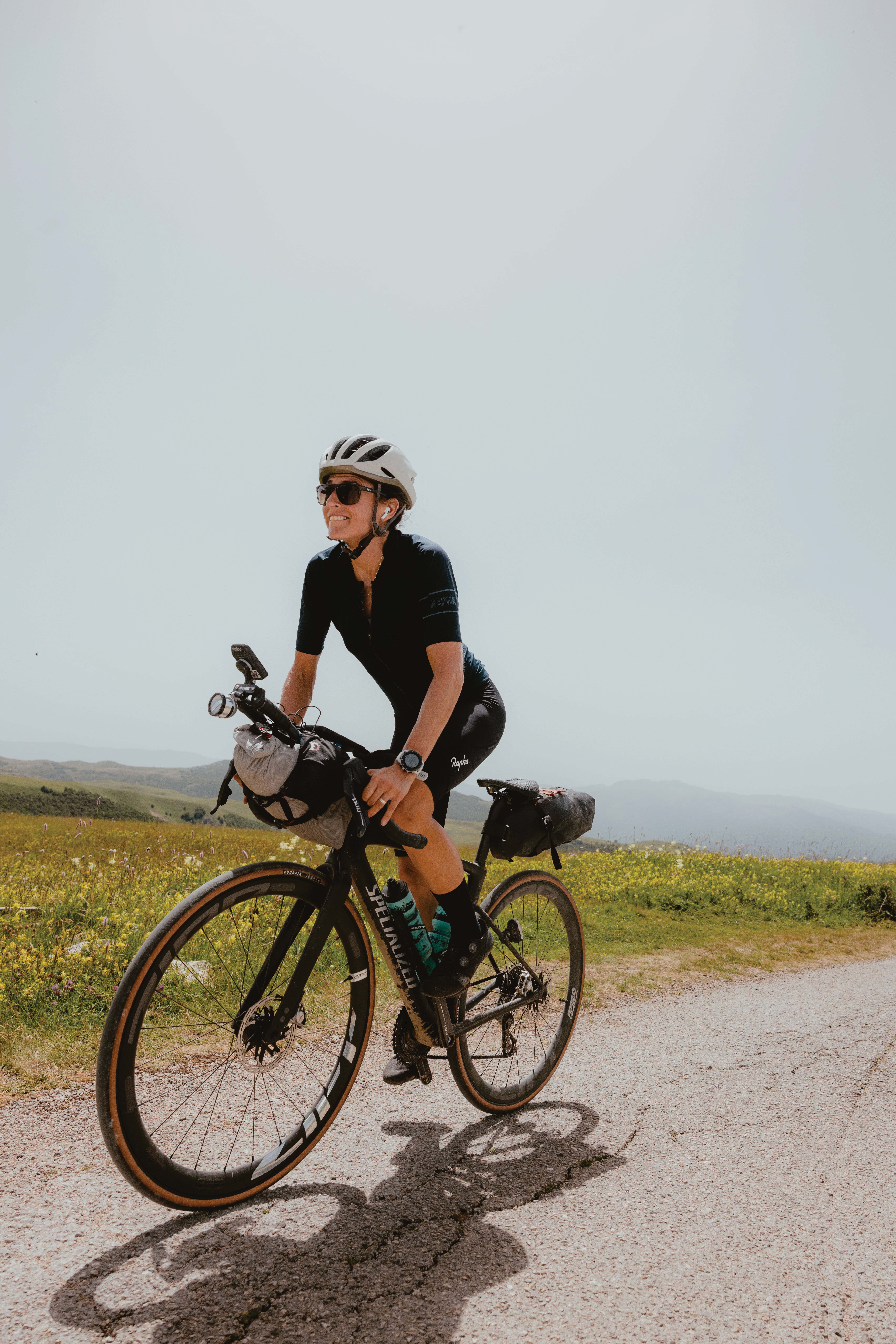 Lael Wilcox ’08 on her bike in Bosnia and Herzogivina. Photo by Rugile Kaladyte.