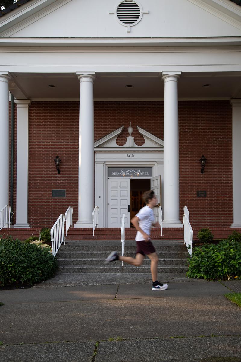 A runner speeds past Kilworth Chapel