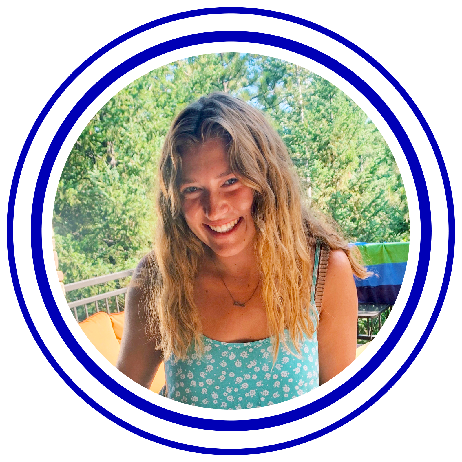 Circular image with colorful rings around it of Lucy Peloso.