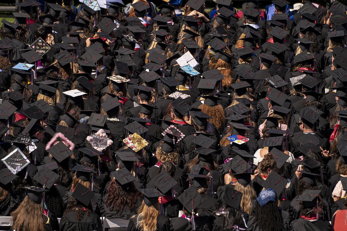 Above look at graduates at a Commencement ceremony. 