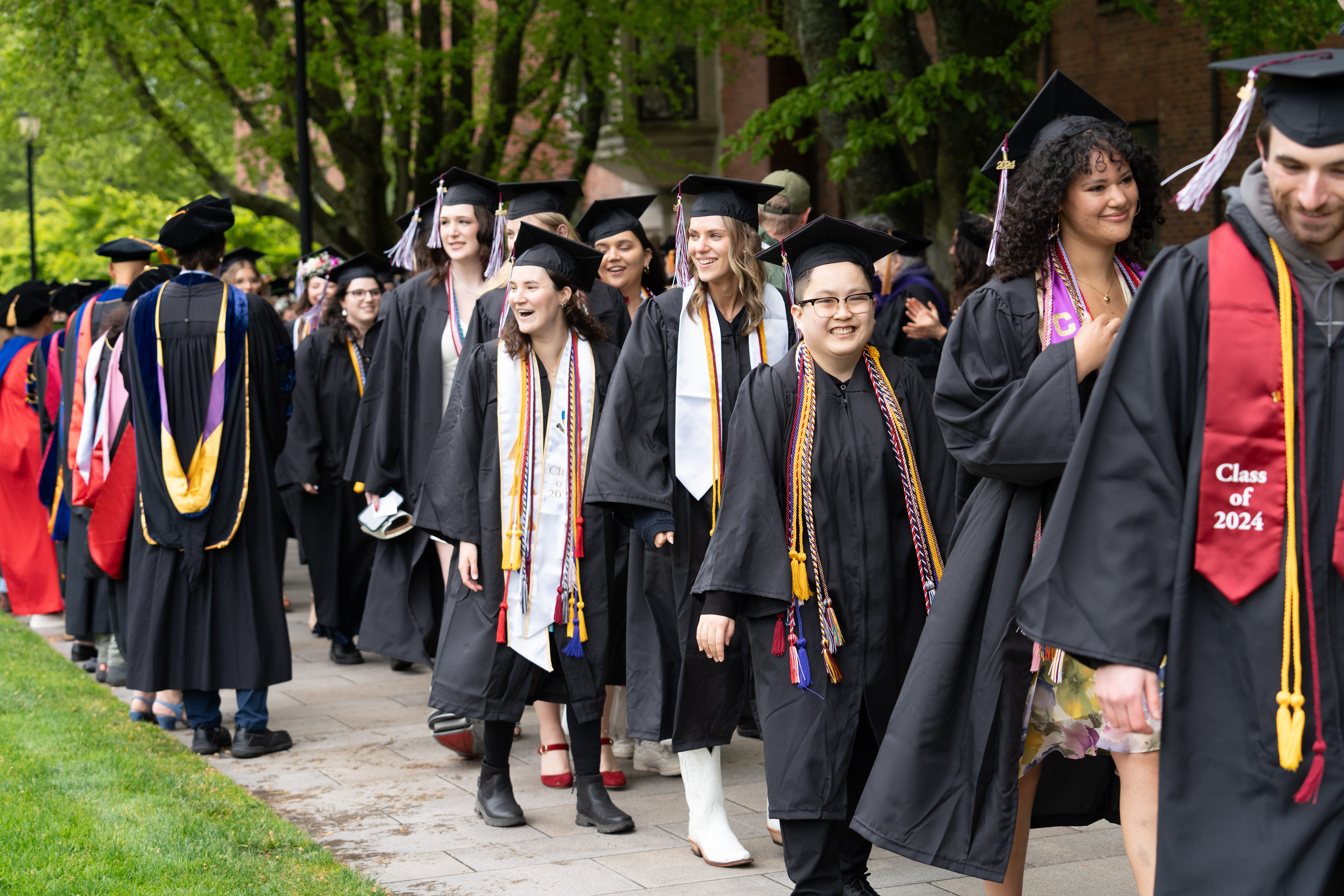 The Class of 2024 on their final stroll along Commencement Walk en route to graduation.