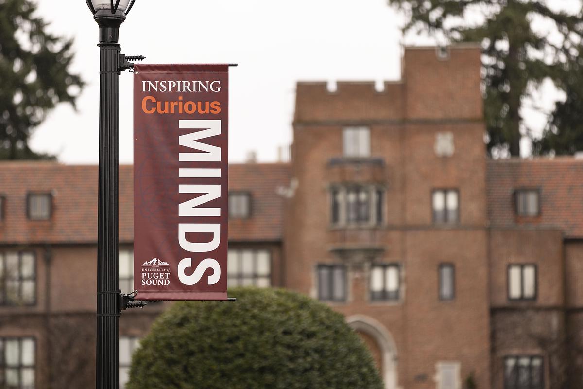 Pole banner reads: Inspiring Curious Minds