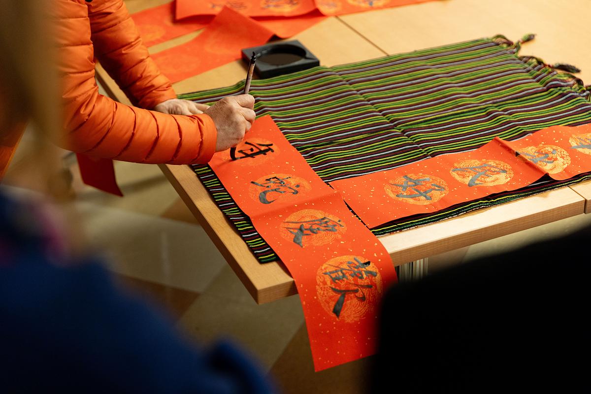 Proffesor Zaixin Hong desmonstrates Chinese calligraphy to celebrate Lunar New Year, Year of the Snake 2025. 