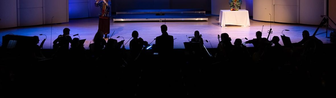 Stage with musicians backlit