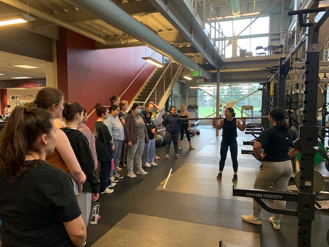 Jena Burkhart DPT’24 leads a women's gym orientation.