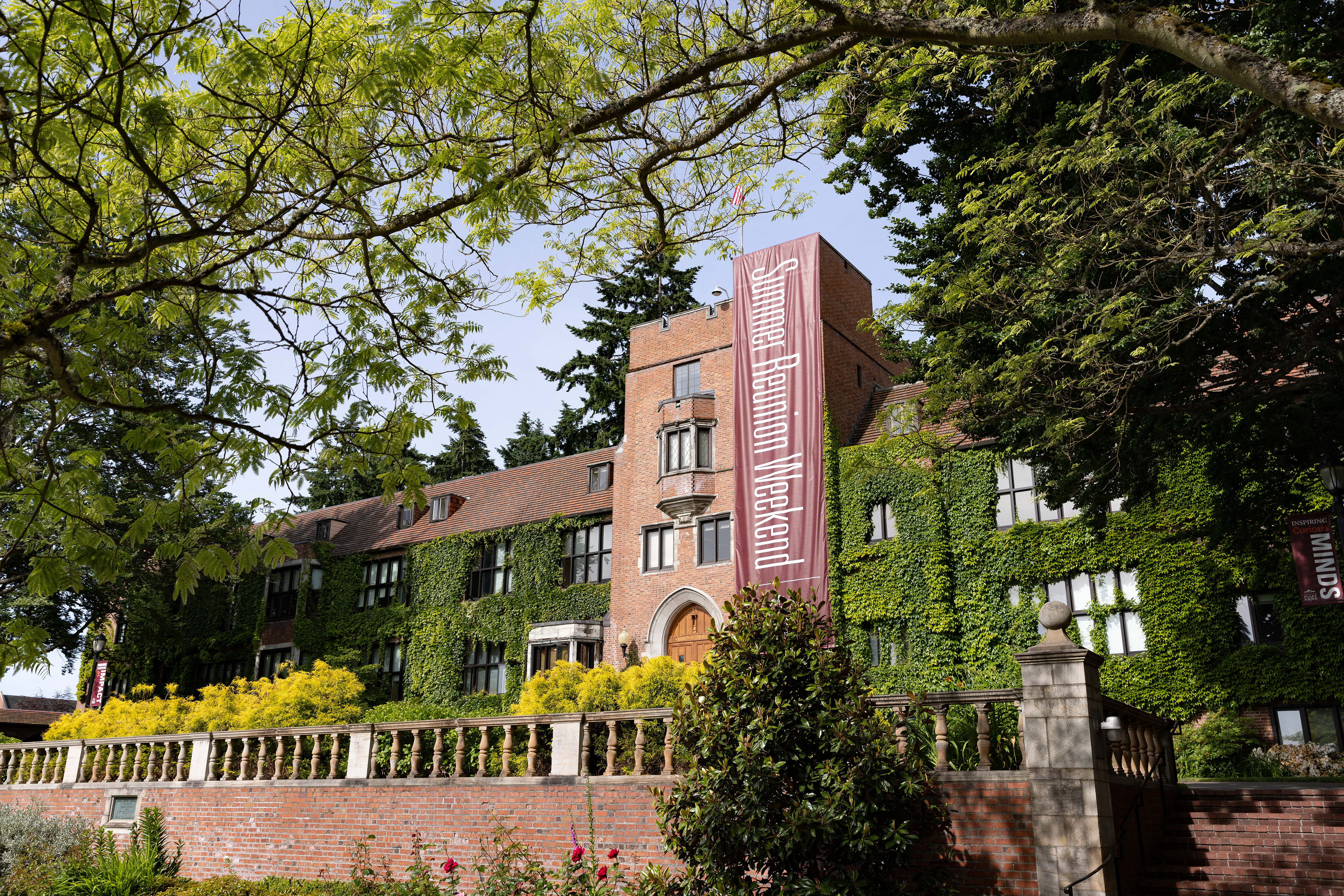 Summer Reunion Weekend banner hangs on campus building