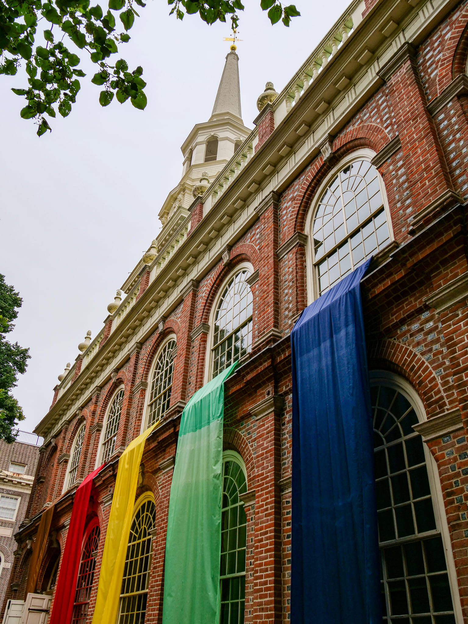 Pride flag on church walls