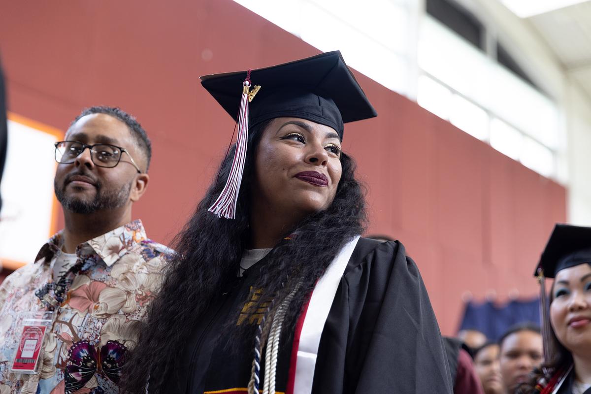 Woman in graduation regalia 