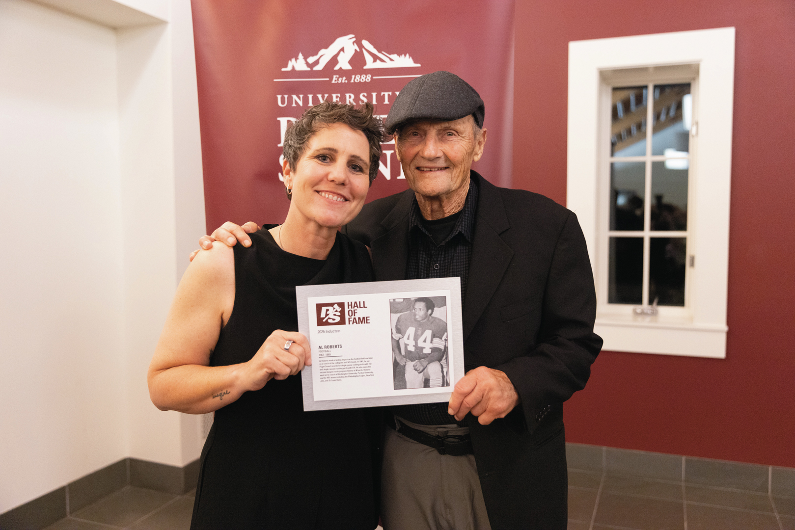 Athletics Director Chelsea Herman and Don Pulisevich ’68, MEd ’68