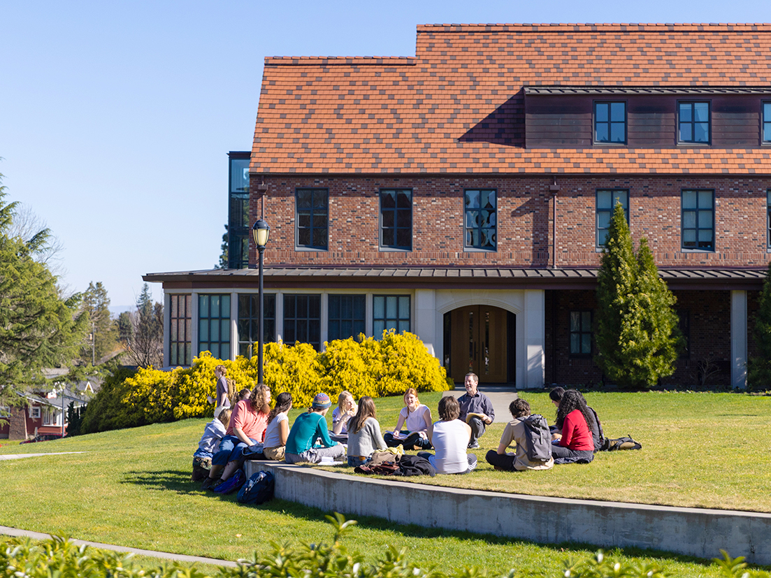 Students sitting outside for a class.
