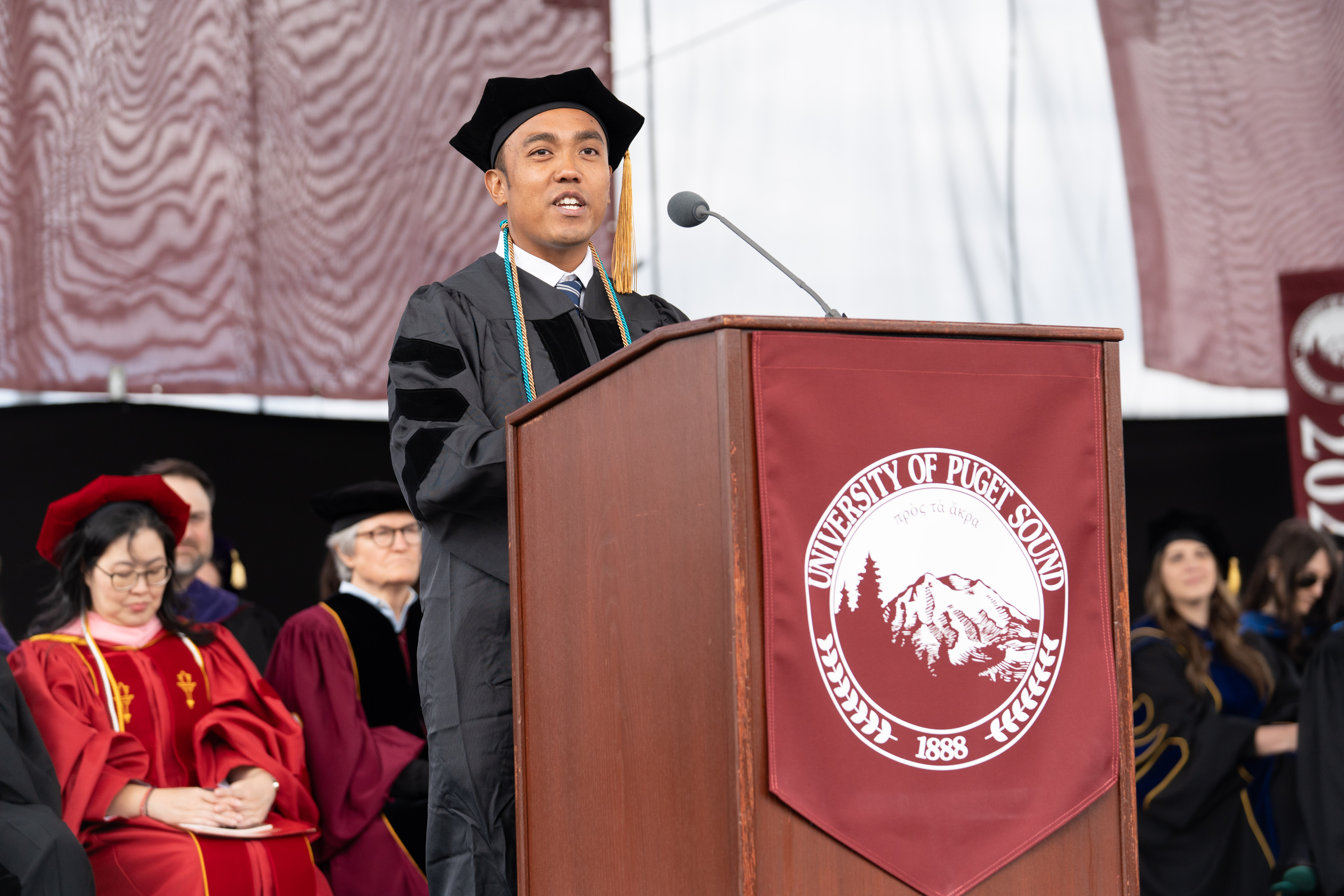 Rovin Ian Antonio ’23, DPT’26 delivers the graduate student address at the Commencement Ceremony on May 10, 2026.
