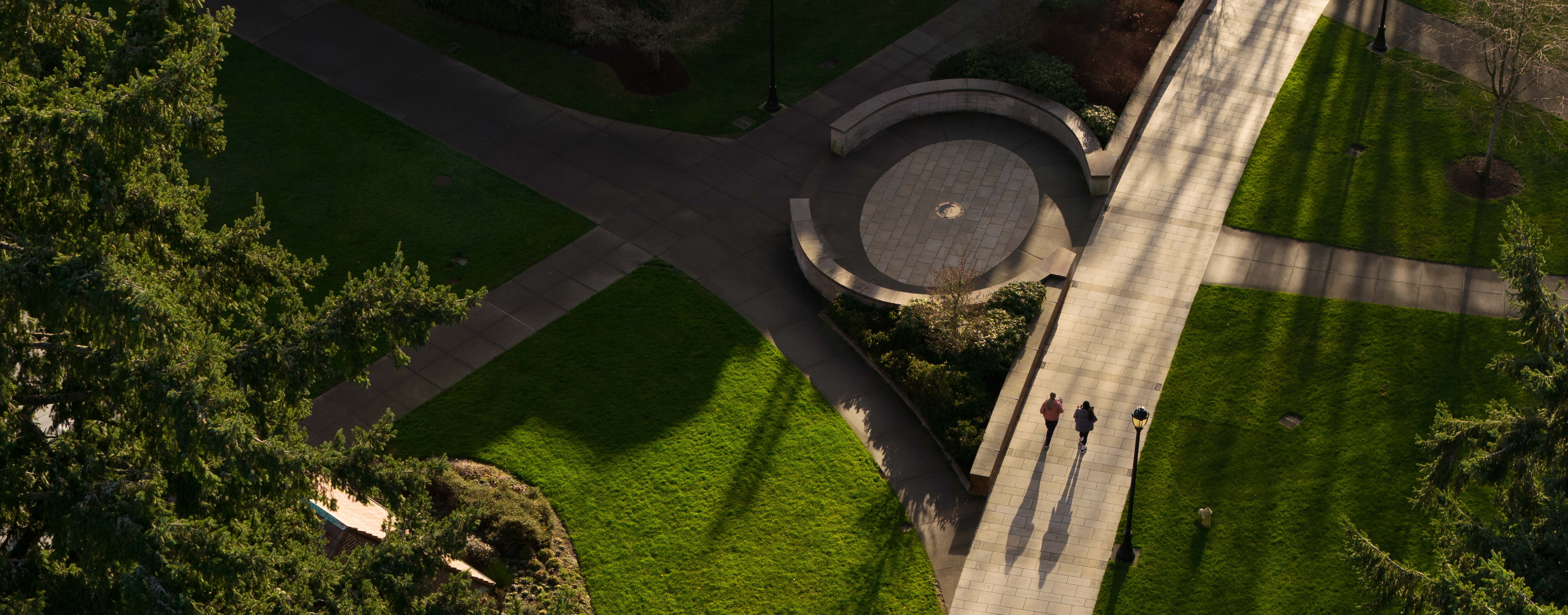 Students walk by Benefactor Plaza as seen from above