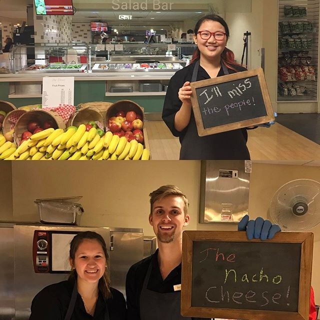 Student workers holding chalkboard messages