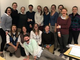 A group photo of students some wearing fake moustaches