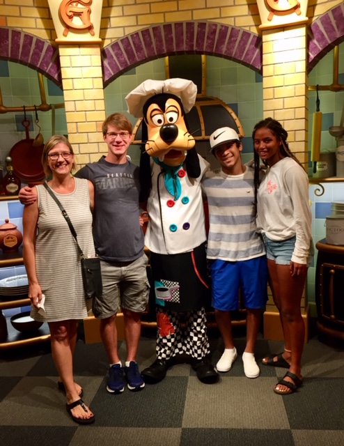 Sheryl Zylstra with children and Goofy character at Disneyland