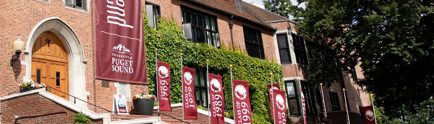 Jones Hall with Summer Reunion Weekend banner and class year bannners