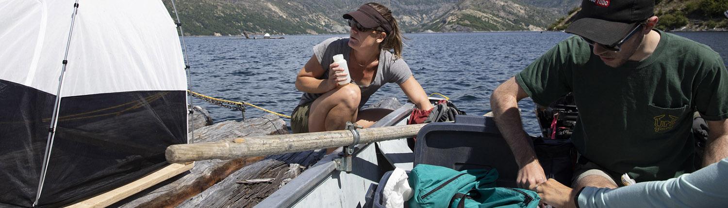 Professor Kena Fox-Dobbs and a student conduct summer research at Spirit Lake near Mt. St. Helen's.