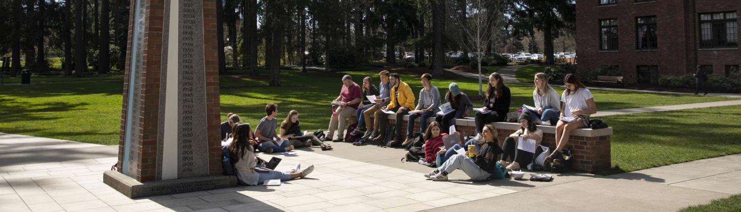 Students on campus near the Color Post on Karlen Quad