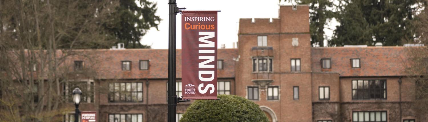 Jones Hall with Curious Minds lamp post banner in forefront
