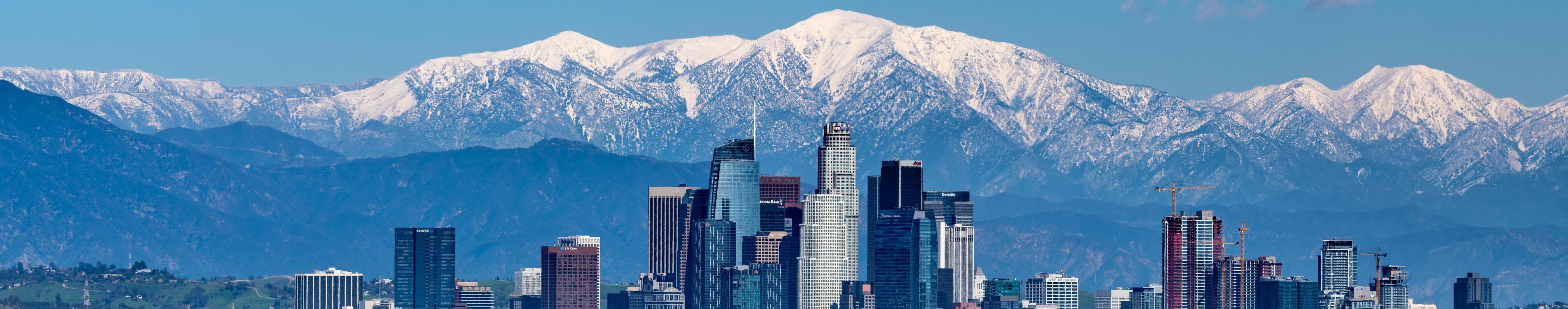 Skyline of Los Angeles with the Sierra Nevada Mountains in the background