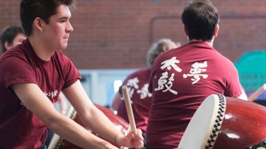 Members of the Taiko drum club perform in Marshall Hall