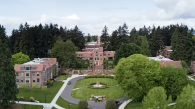 Aerial image of campus buildings and lawns