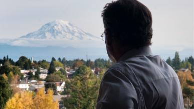 President Ronald R. Thomas looks out over Tacoma and Mount Rainier.