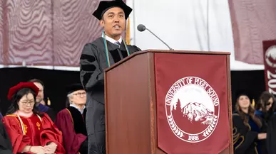 Rovin Ian Antonio ’23, DPT’26 delivers the graduate student address at the Commencement Ceremony on May 10, 2026.